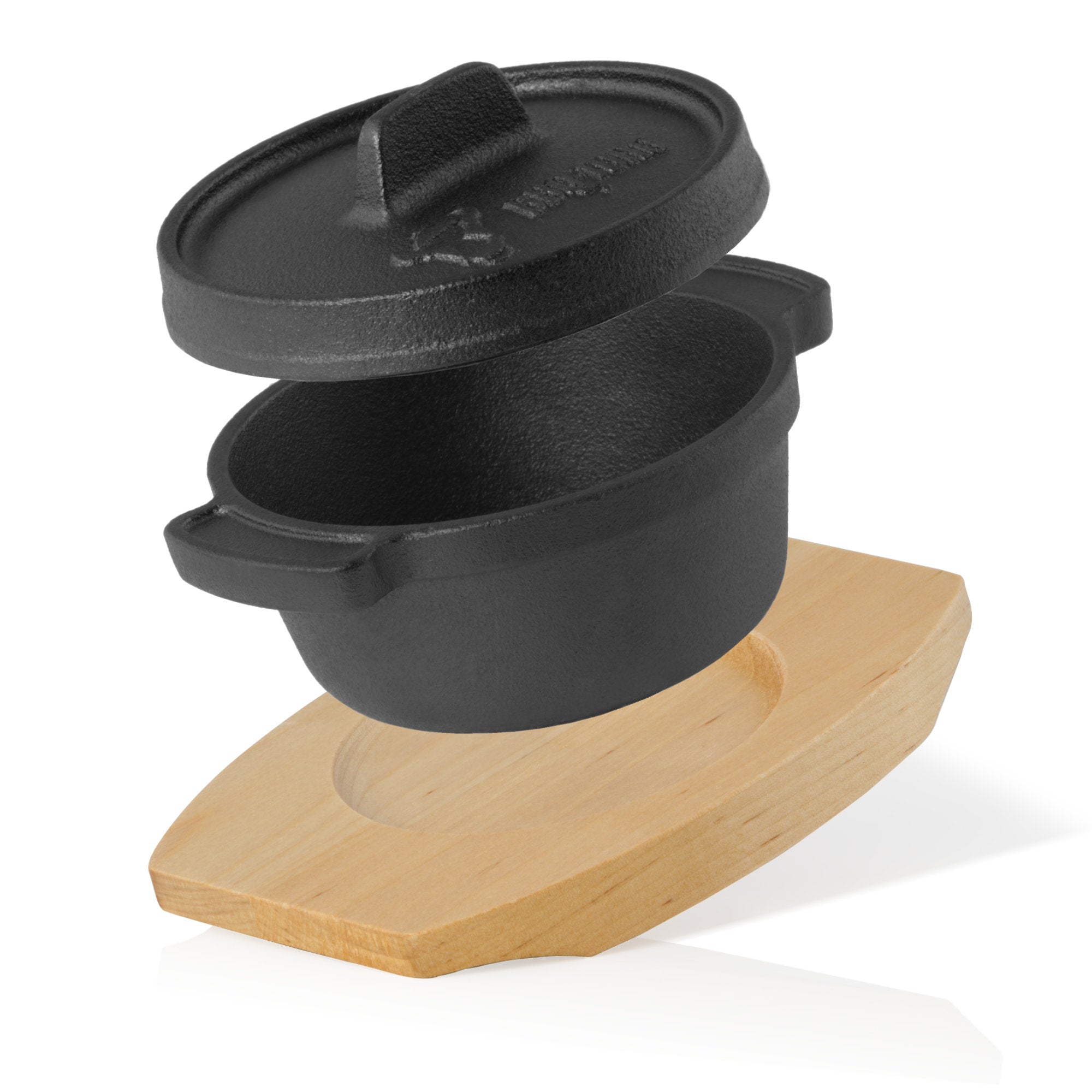 Mini cocotte en fonte, Ø 11 cm, avec socle en bois.